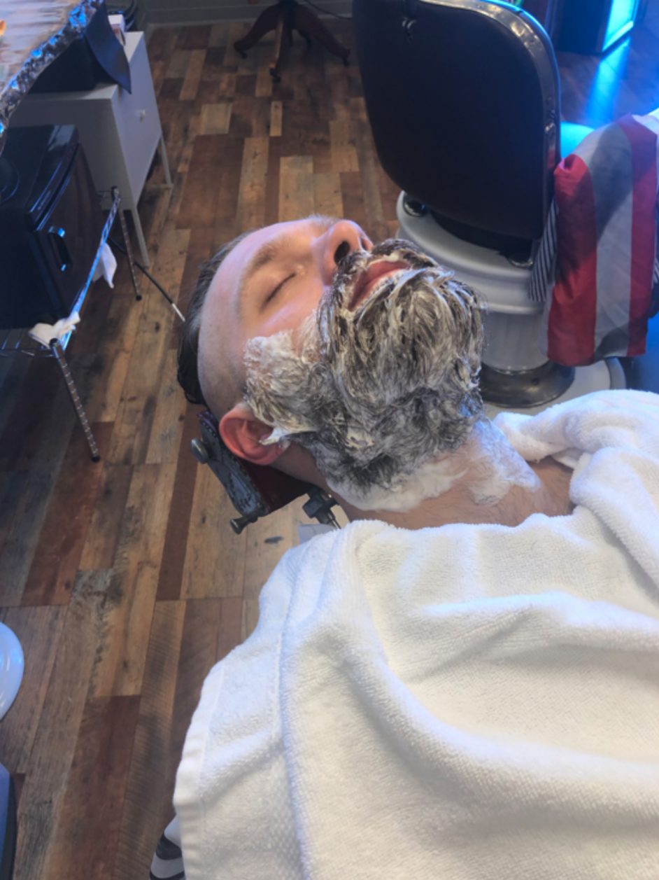 Before: client lathered up in the chair for a full shave